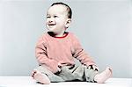 Portrait of baby boy wearing striped top looking away