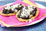 Tlacoyos (oval corn tortillas) with huitlacoche (corn fungus) and cheese (Mexico)