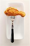 A Fried Drumstick on a Fork