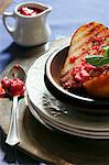 Grilled Peaches with Raspberry Compote in a Bowl