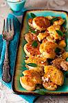 Platter of Sizzling Smashed Potatoes with Garlic, Curry and Smoked Paprika