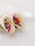 Wraps filled with houmous and tomatoes