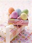 An Easter parcel and brightly coloured eggs for Easter