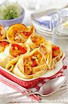 Pancakes filled with chicken, peppers and pineapple in garlic sauce