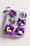 Hazelnuts with chocolate glaze in a muffin tin