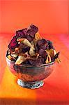 Assorted vegetable crisps in a silver bowl