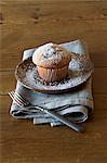 A muffin dusted with icing sugar