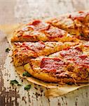 Sliced Pepperoni Pizza on Parchment Paper