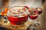 Fruity Punch with Cinnamon Sticks in a Punch Bowl and Glasses