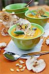 Cream of squash soup with apple crisps and pumpkin seeds