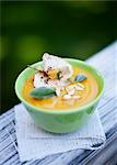 Cream of squash soup with apple crisps and pumpkin seeds