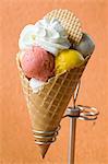 Fruit ice cream with cream in a wafer cone