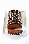 Rehrücken (cake designed to look like a saddle of venison) with chocolate icing and sliced almonds