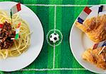 Spaghetti (Italy) and croissants (France) with football-themed decoration