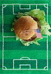 Hamburger with a US flag on a football-field mat