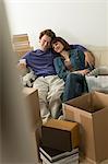 Couple taking a break whilst moving house