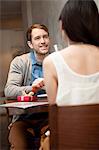 Young couple sitting in restaurant