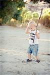 Young male toddler with stick