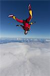 Female skydiver free falling upside down