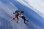 Small group of skydivers in formation