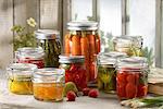 Variety of fruit and vegetables pickled in jars