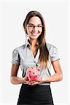 Beautiful and attractive young business woman smiling holding a piggy bank, isolated on white