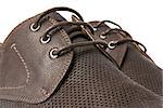 Studio shot of brown mens shoe on white background.