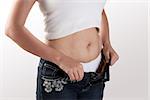 Female fatty stomach and loose jeans   over white background