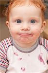 Portrait of Funny Baby With Dirty Face After Eating