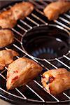 Tasty chicken meat on gas grill