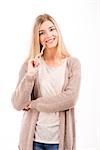 Beautiful blonde woman smiling and holding a pen, isolated over white background