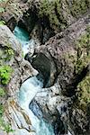 Summer Liechtensteinklamm gorge with stream and waterfalls in Austria.