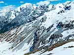 Summer mountain view from Stelvio pass with snow on slope (Italy)