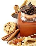 Still life of wooden coffee grinder, sugar, biscuits