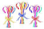 Three Bundles of Colorful Candy Canes On White Background