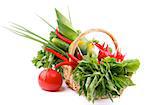 Basket with Various Fresh Raw Vegetables and Greens and Big Red Tomato isolated on white background