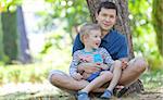 happy smiling family of two enjoying summer time at the park