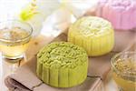 Traditional Chinese mid autumn festival food. Snowy skin mooncakes.  The Chinese words on the mooncakes is green tea with red bean paste, noble delight and lotus paste, not a logo or trademark.