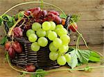 Organic grapes in a basket on a wooden table
