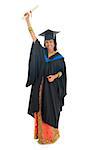 Full length happy Indian university student in graduation gown and cap holding diploma certificate. Portrait of mixed race Asian Indian and African American female model standing isolated on white background.