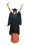 Full length arms up Indian university student in graduation gown and cap holding diploma certificate. Portrait of mixed race Asian Indian and African American female model standing isolated on white background.
