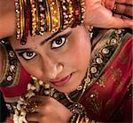 Close up face of beautiful young Indian woman in traditional sari dress