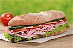 Baguette with ham, cheese, tomatoes, cucumber and lettuce