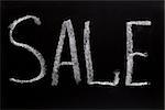 Word sale writtent with white chalk on blackboard