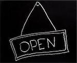 Open sign made with chalk on a blackboard