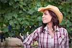 Young Mixed Race Adult Female Portrait Outside Wearing Cowboy Hat in Vineyard.