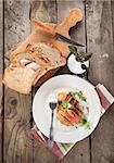 Succulent meat steak and bread on a wooden background