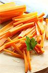 carrots cut into sticks and leaf of parsley