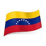 National flag of Venezuela: yellow, blue and red horizontal stripes with semi-circle of stars on cental band.