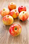 Fresh red apples on a wooden table